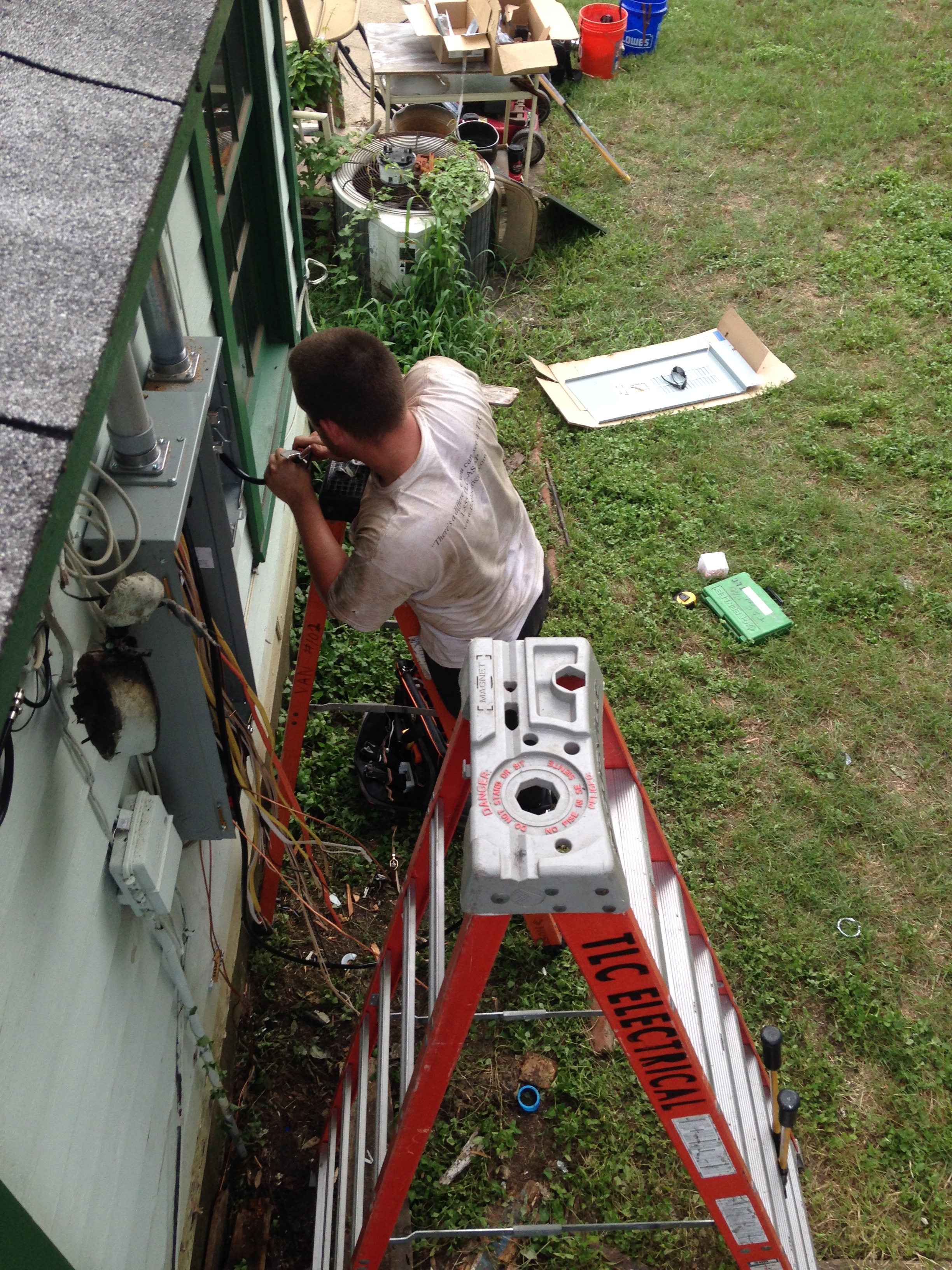 TLC Electrician Installing New Exterior Panel