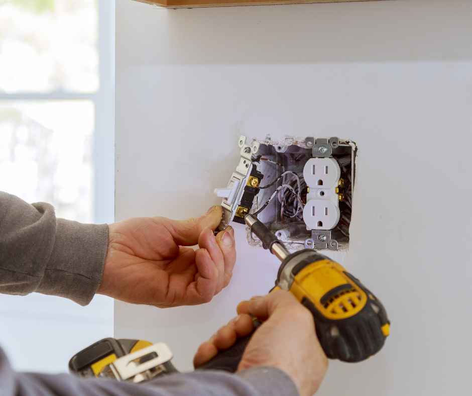 Working on an electrical outlet