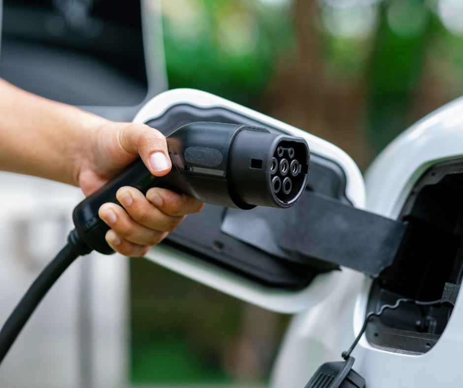 EV charger being plugged in to an electric vehicle