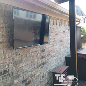 Flat Screen TV Mounted on Brick