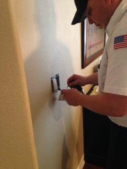 TLC Electrician Installing Light Switch In Denton TX